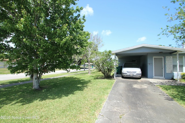 1798 Hudson Cir S, Melbourne, FL 32935 - view of home's exterior featuring a yard, driveway, and a carport