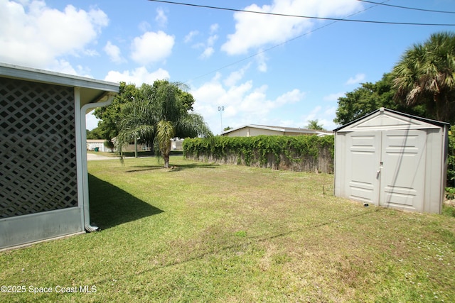 1798 Hudson Cir S, Melbourne, FL 32935 - view of yard with a storage unit and an outbuilding