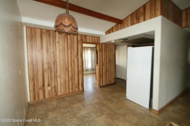 1798 Hudson Cir S, Melbourne, FL 32935 - empty room featuring wooden walls and beam ceiling