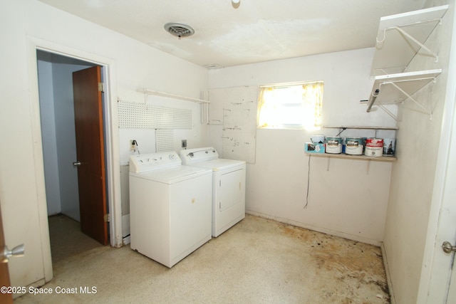 1798 Hudson Cir S, Melbourne, FL 32935 - clothes washing area featuring washing machine and clothes dryer, laundry area, and visible vents