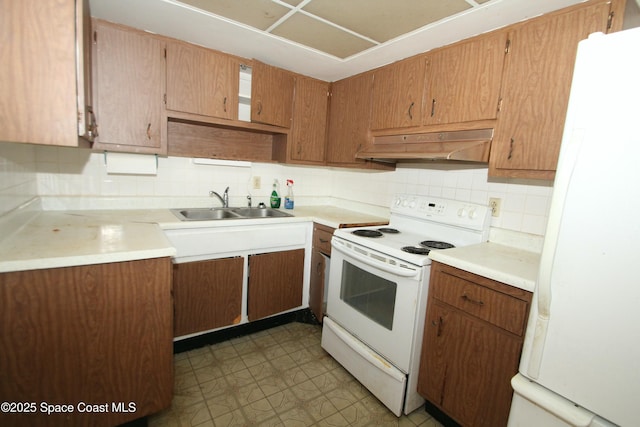 1798 Hudson Cir S, Melbourne, FL 32935 - kitchen with white appliances, light floors, under cabinet range hood, a sink, and backsplash