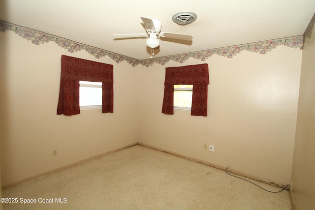 1798 Hudson Cir S, Melbourne, FL 32935 - empty room with light colored carpet, ceiling fan, visible vents, and plenty of natural light
