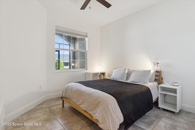 bedroom with baseboards and ceiling fan