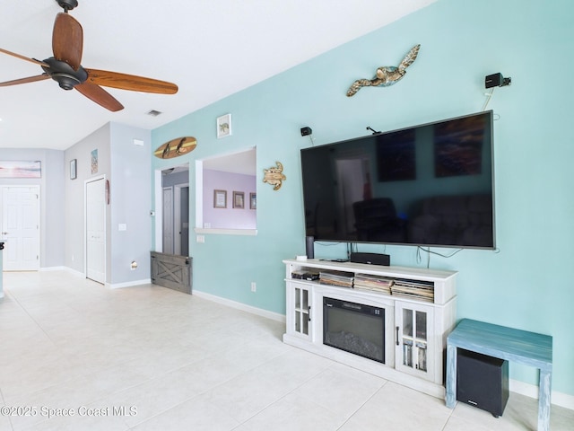 2515 SE Marquez Ave SE, Palm Bay, FL 32909 - living room with light tile patterned flooring, ceiling fan, baseboards, and visible vents