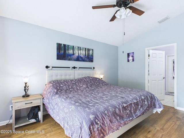 2515 SE Marquez Ave SE, Palm Bay, FL 32909 - bedroom featuring wood finished floors, baseboards, vaulted ceiling, and visible vents