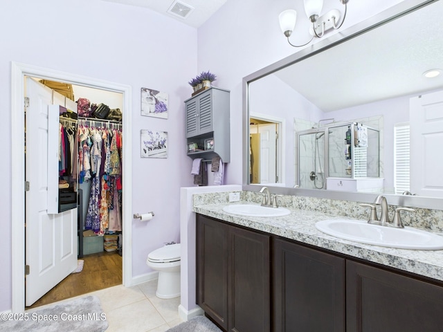2515 SE Marquez Ave SE, Palm Bay, FL 32909 - full bathroom featuring a shower stall, tile patterned flooring, visible vents, and a sink