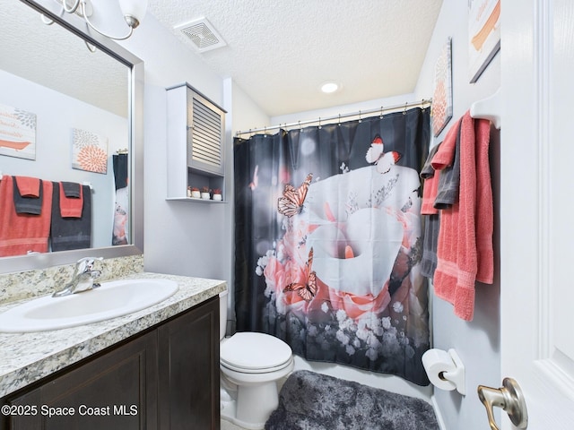 2515 SE Marquez Ave SE, Palm Bay, FL 32909 - full bath with a textured ceiling, vanity, a shower with curtain, visible vents, and toilet