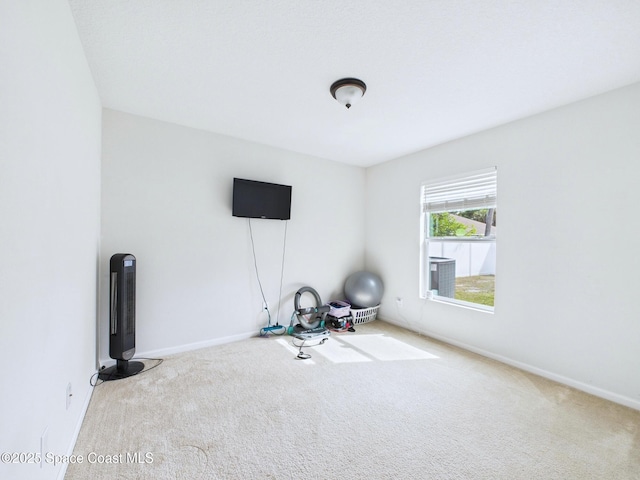 2515 SE Marquez Ave SE, Palm Bay, FL 32909 - exercise room with baseboards and carpet floors