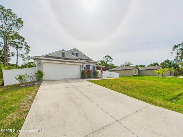 2515 SE Marquez Ave SE, Palm Bay, FL 32909 - view of front of house featuring concrete driveway, stucco siding, a front yard, a garage, and fence