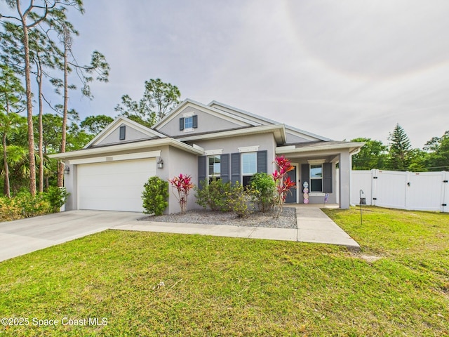 2515 SE Marquez Ave SE, Palm Bay, FL 32909 - view of front facade with a garage, stucco siding, a front lawn, a gate, and driveway