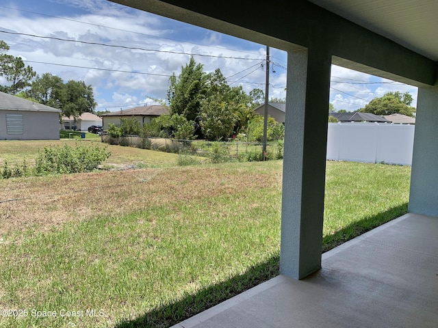 2205 Sans Souci Ave SE, Palm Bay, FL 32909 - fenced backyard with a patio area