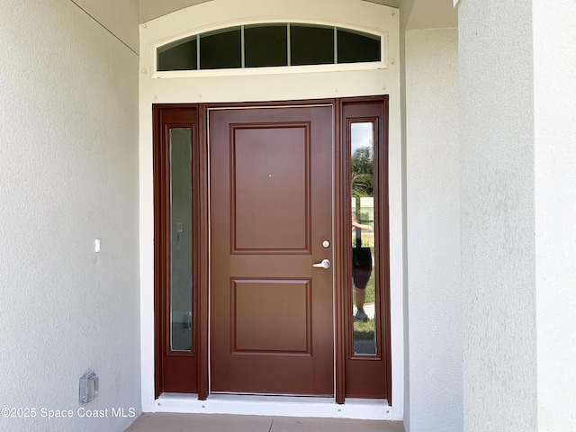 2205 Sans Souci Ave SE, Palm Bay, FL 32909 - property entrance with stucco siding