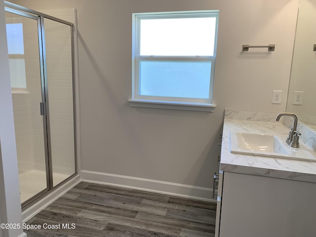 2205 Sans Souci Ave SE, Palm Bay, FL 32909 - bathroom featuring vanity, a shower stall, and wood finished floors