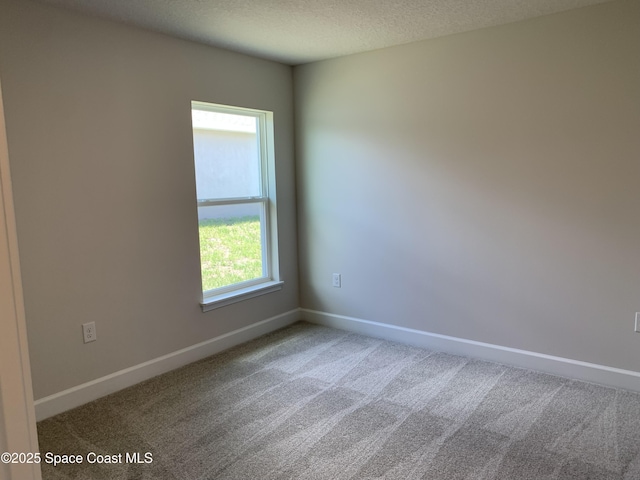 2205 Sans Souci Ave SE, Palm Bay, FL 32909 - unfurnished room featuring carpet and a textured ceiling