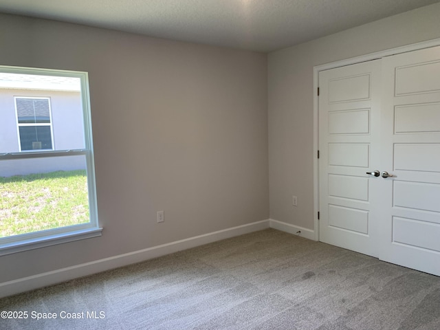 2205 Sans Souci Ave SE, Palm Bay, FL 32909 - unfurnished room with carpet floors and baseboards