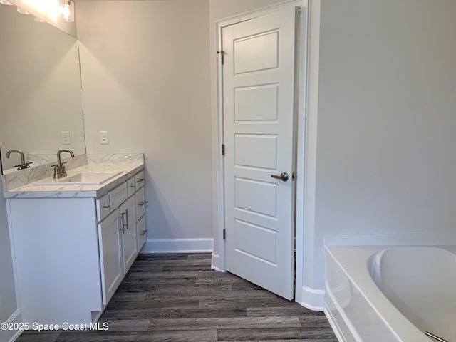 2205 Sans Souci Ave SE, Palm Bay, FL 32909 - full bathroom with vanity, wood finished floors, and a bath