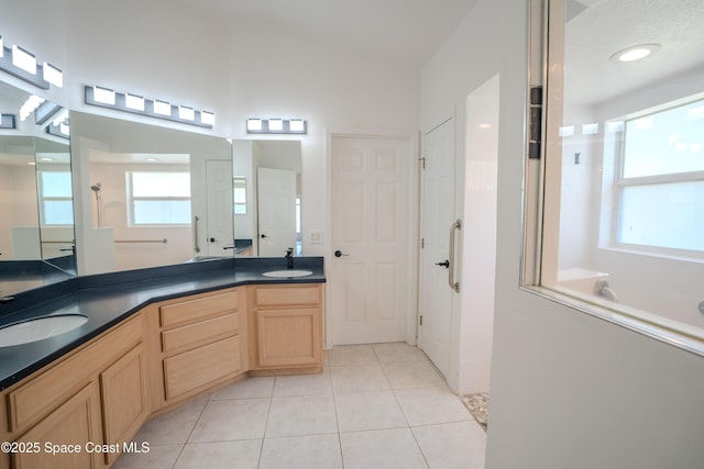 3780 Starlight Ave, Merritt Island, FL 32953 - bathroom with walk in shower, tile patterned flooring, double vanity, and a sink