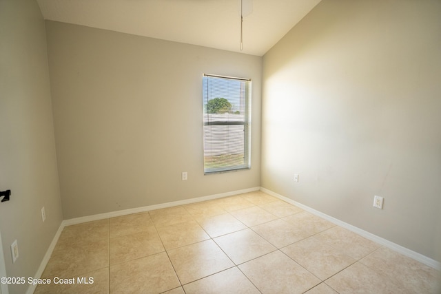 3780 Starlight Ave, Merritt Island, FL 32953 - unfurnished room featuring light tile patterned floors, baseboards, and lofted ceiling