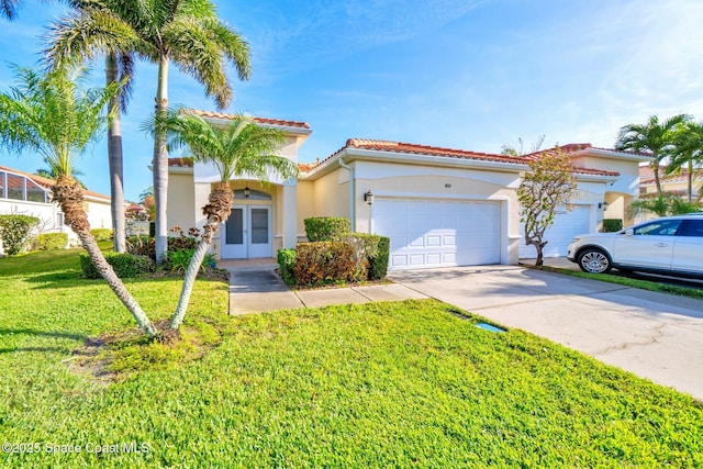 8657 Villanova Dr Unit 901, Cape Canaveral, FL 32920 - mediterranean / spanish-style house featuring stucco siding, a front yard, a tile roof, an attached garage, and concrete driveway
