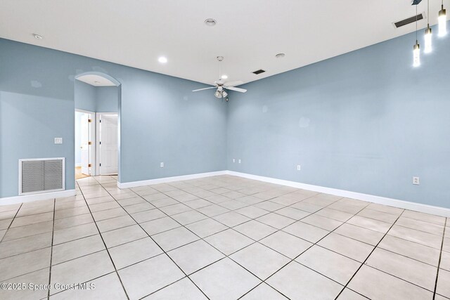 8657 Villanova Dr Unit 901, Cape Canaveral, FL 32920 - unfurnished room with arched walkways, baseboards, a ceiling fan, and visible vents