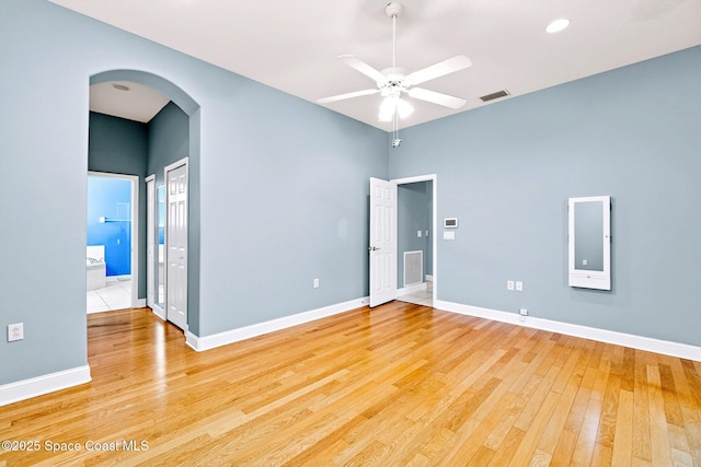 8657 Villanova Dr Unit 901, Cape Canaveral, FL 32920 - spare room with arched walkways, light wood finished floors, a ceiling fan, and visible vents