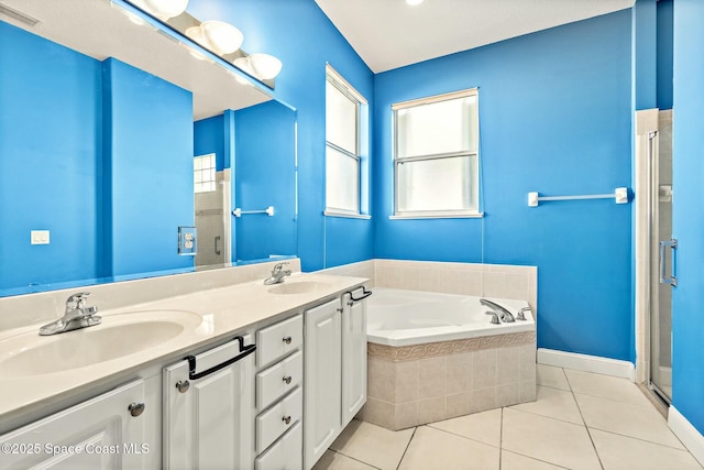 8657 Villanova Dr Unit 901, Cape Canaveral, FL 32920 - bathroom with a garden tub, a shower stall, visible vents, a sink, and tile patterned floors