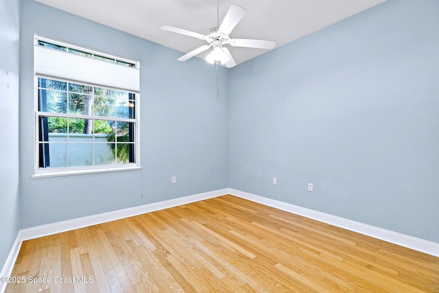 8657 Villanova Dr Unit 901, Cape Canaveral, FL 32920 - empty room featuring baseboards, light wood-type flooring, and ceiling fan