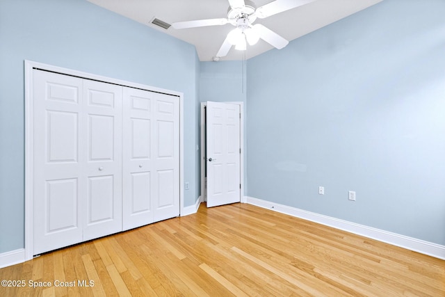 8657 Villanova Dr Unit 901, Cape Canaveral, FL 32920 - unfurnished bedroom featuring a closet, baseboards, light wood finished floors, and visible vents