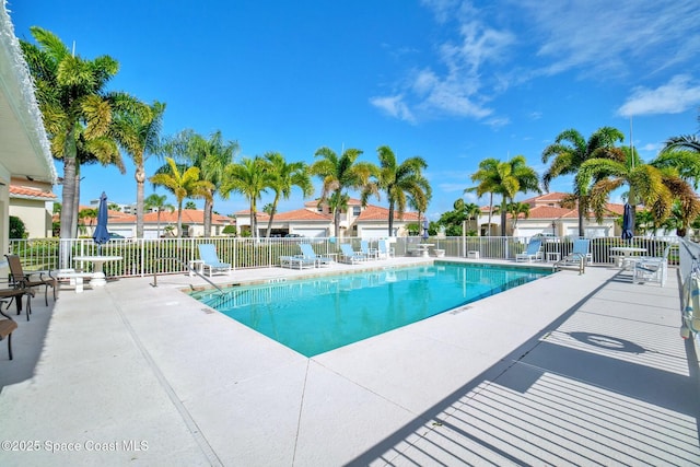 8657 Villanova Dr Unit 901, Cape Canaveral, FL 32920 - community pool featuring a patio and fence