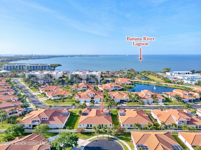 8657 Villanova Dr Unit 901, Cape Canaveral, FL 32920 - birds eye view of property with a water view and a residential view