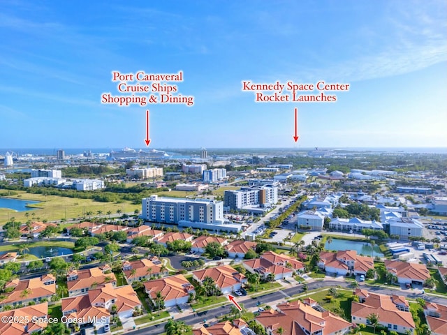 8657 Villanova Dr Unit 901, Cape Canaveral, FL 32920 - drone / aerial view featuring a water view and a city view