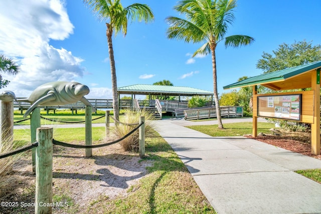 8657 Villanova Dr Unit 901, Cape Canaveral, FL 32920 - surrounding community with a lawn