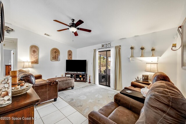 999 Jupiter Blvd NW, Palm Bay, FL 32907 - living area with visible vents, ceiling fan, vaulted ceiling, and light tile patterned floors