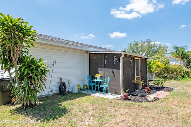 999 Jupiter Blvd NW, Palm Bay, FL 32907 - exterior space with a patio area and a lawn