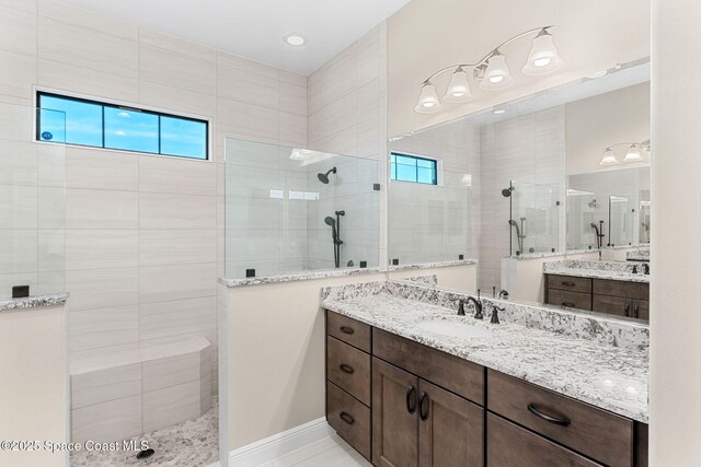 full bath with vanity and walk in shower