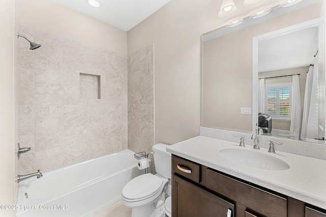 bathroom with toilet, vanity, ensuite bathroom, and shower / washtub combination