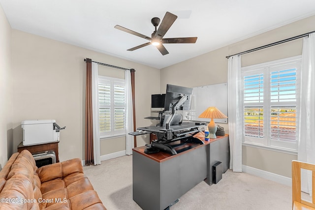 office with carpet, a ceiling fan, and plenty of natural light