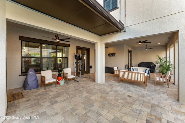 view of patio / terrace with an outdoor living space and ceiling fan