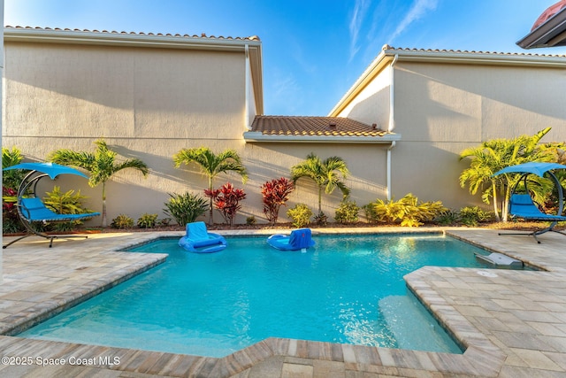 pool with a patio