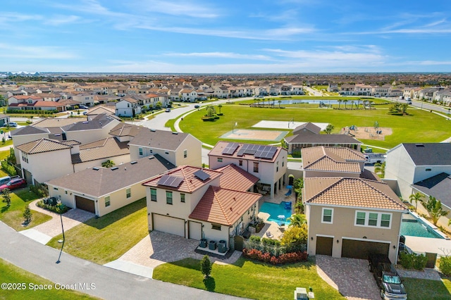 bird's eye view featuring a water view and a residential view