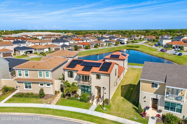 birds eye view of property with a residential view and a water view