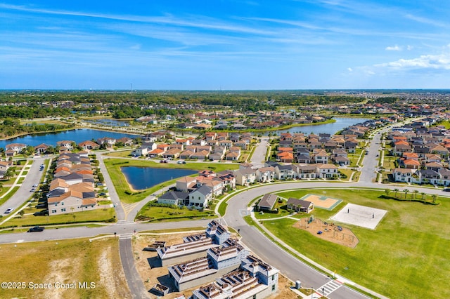 aerial view with a residential view and a water view