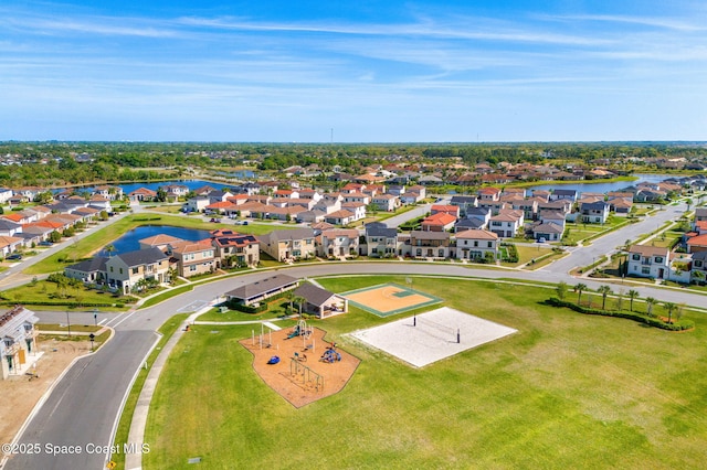 drone / aerial view with a residential view and a water view