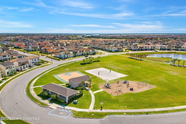 birds eye view of property featuring a residential view and a water view