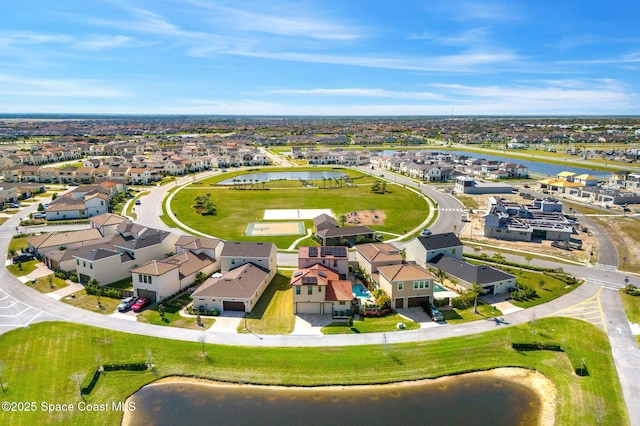 aerial view with a water view and a residential view
