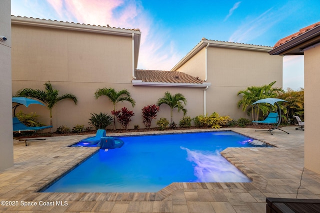 outdoor pool with a patio