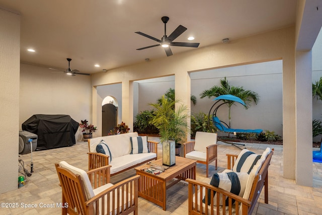 view of patio featuring an outdoor living space, grilling area, and ceiling fan
