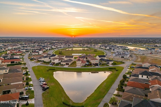 bird's eye view with a water view and a residential view