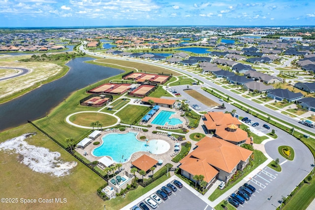 aerial view featuring a water view and a residential view