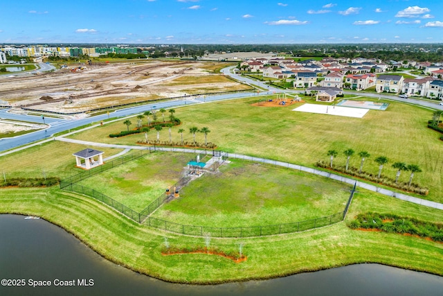birds eye view of property featuring a residential view and a water view